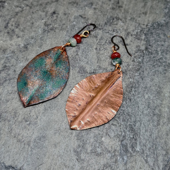 Showing reverse of hammered copper leaf earrings