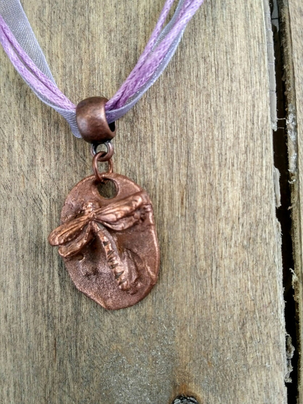 Detail of copper dragonfly necklace