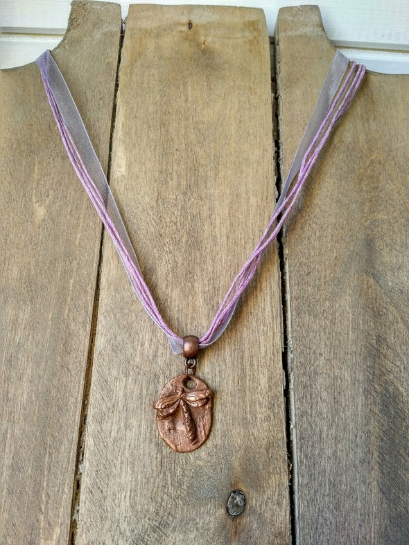 Moonsilver copper dragonfly necklace on lilac ribbon