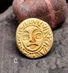 Ceramic sun brooch with face