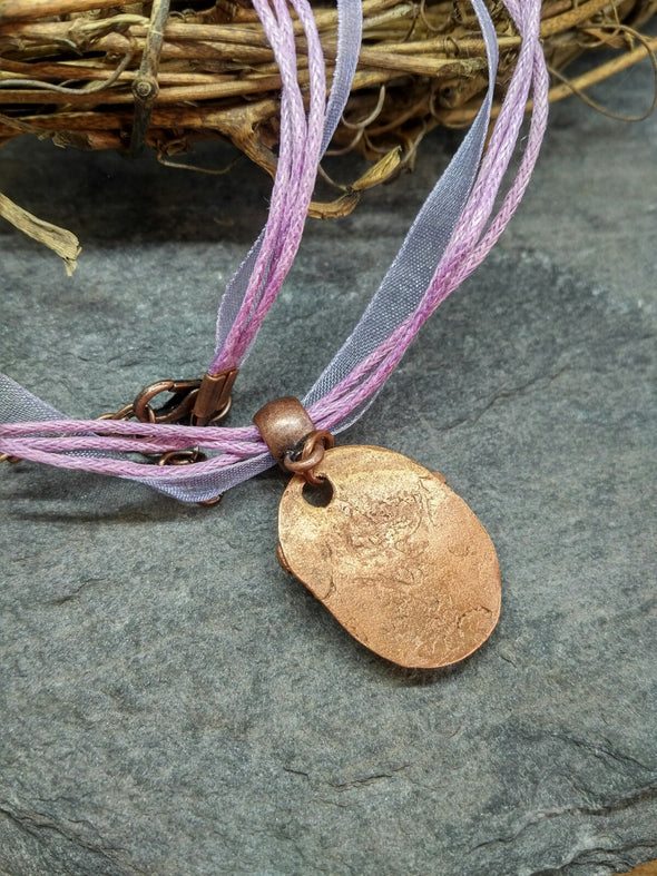 Back view of copper dragonfly necklace
